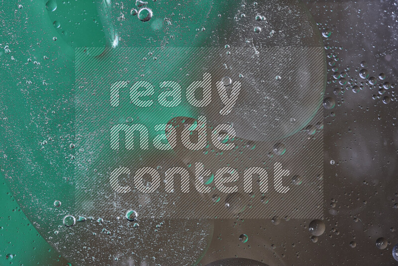 Close-ups of abstract oil bubbles on water surface in shades of green and brown