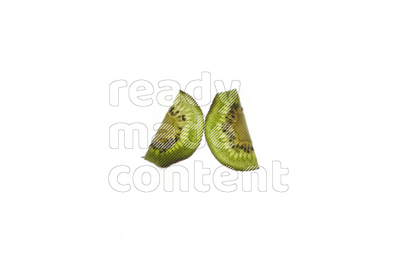 Kiwi slices on illuminated white background