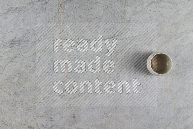 A multicolored pottery Bowl on grey marble background