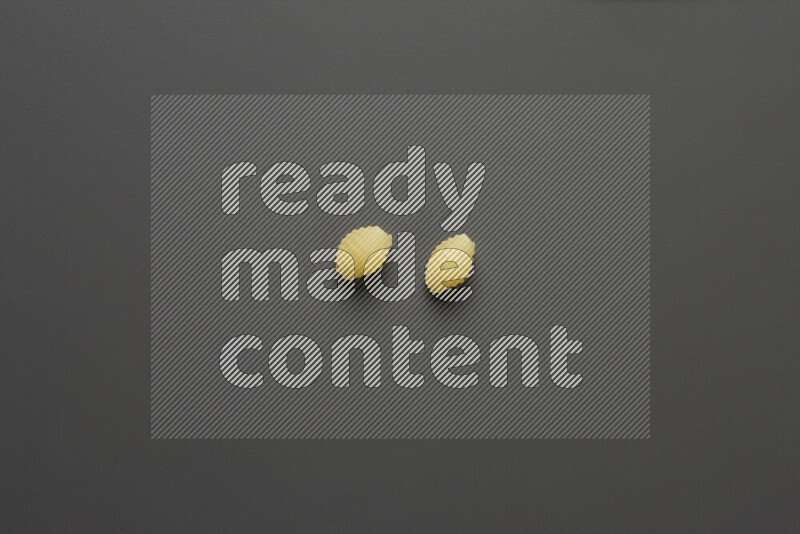 Shells pasta on grey background