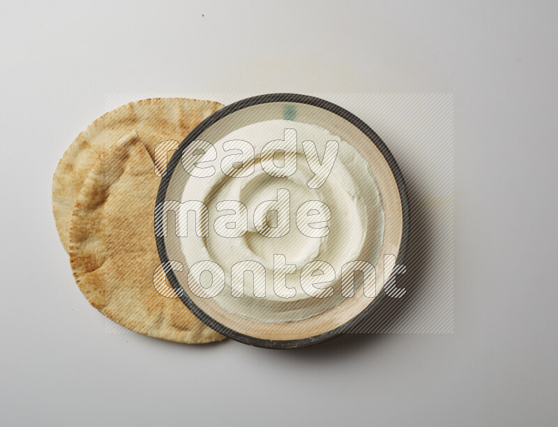 plain Lebnah in a pottery plate on a white background