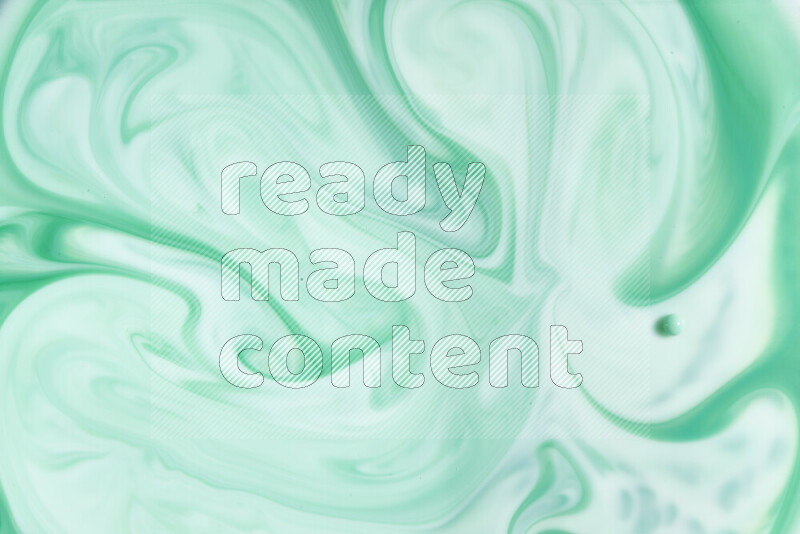 A close-up of abstract swirling patterns in green gradients