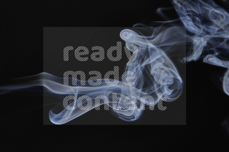 Motion of wavy smoke isolated on dark background