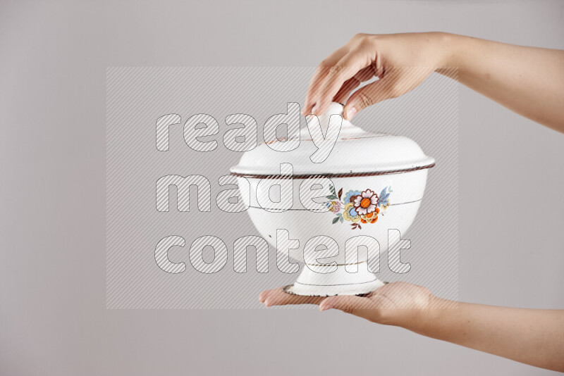 Woman hands holding different metal essentials in different positions