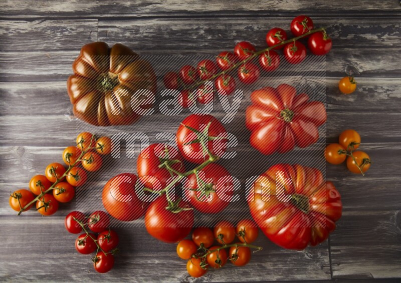 Mixed Tomatoes types topview on a textured vinyl backgrounds