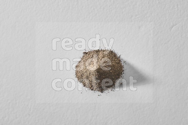 Black pepper powder on a white background