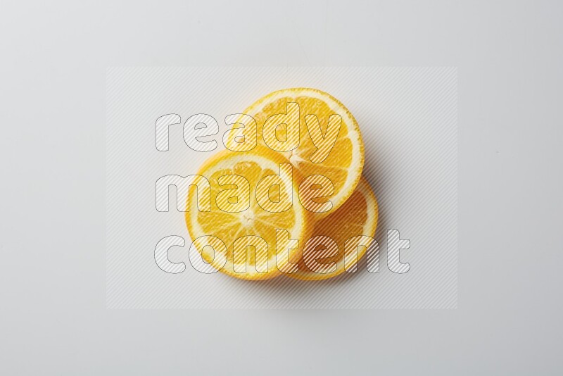 Three orange slices on a white background