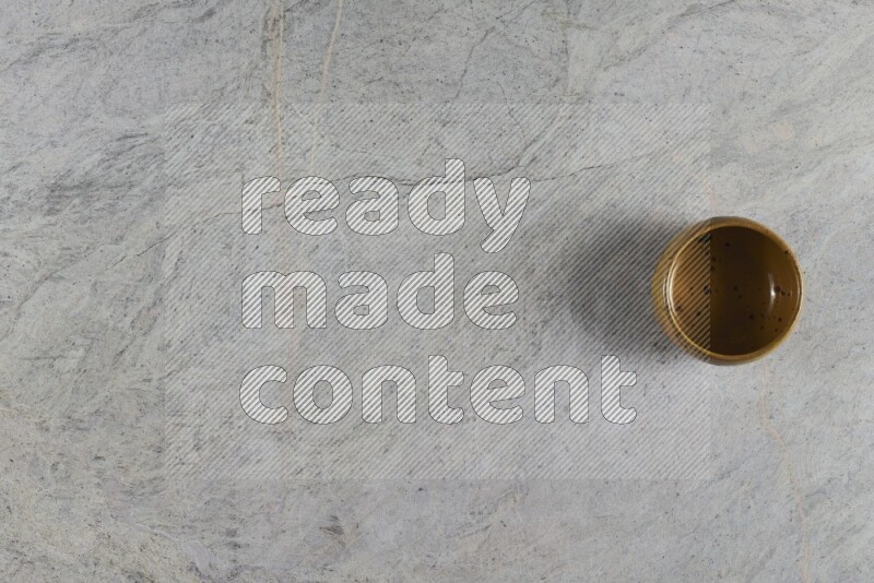 A multicolored pottery Bowl on grey marble background