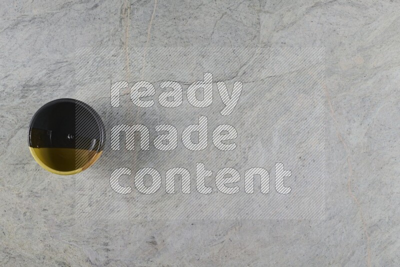 A multicolored pottery Bowl on grey marble background