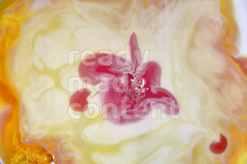 A close-up of abstract swirling patterns in orange, red and white