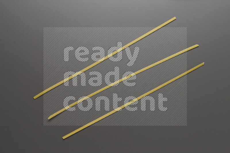 Linguini pasta on grey background