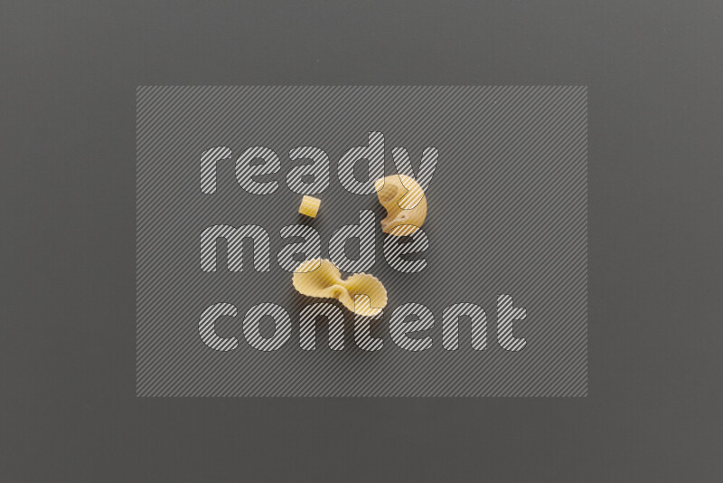 Different pasta types on grey background