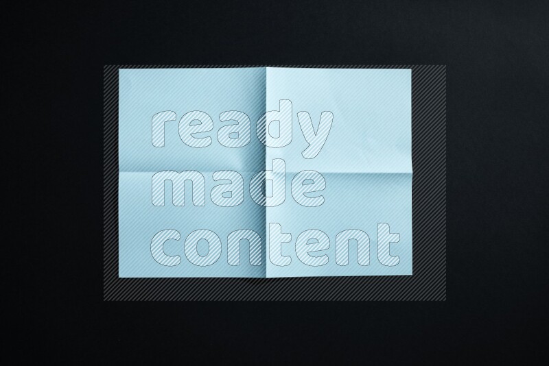 Blue paper sheet on black background