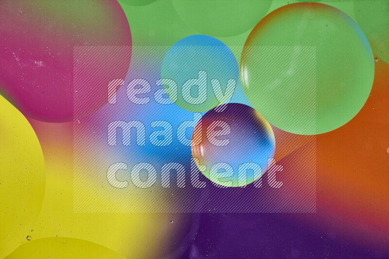 Close-ups of abstract oil bubbles on water surface in multicolors