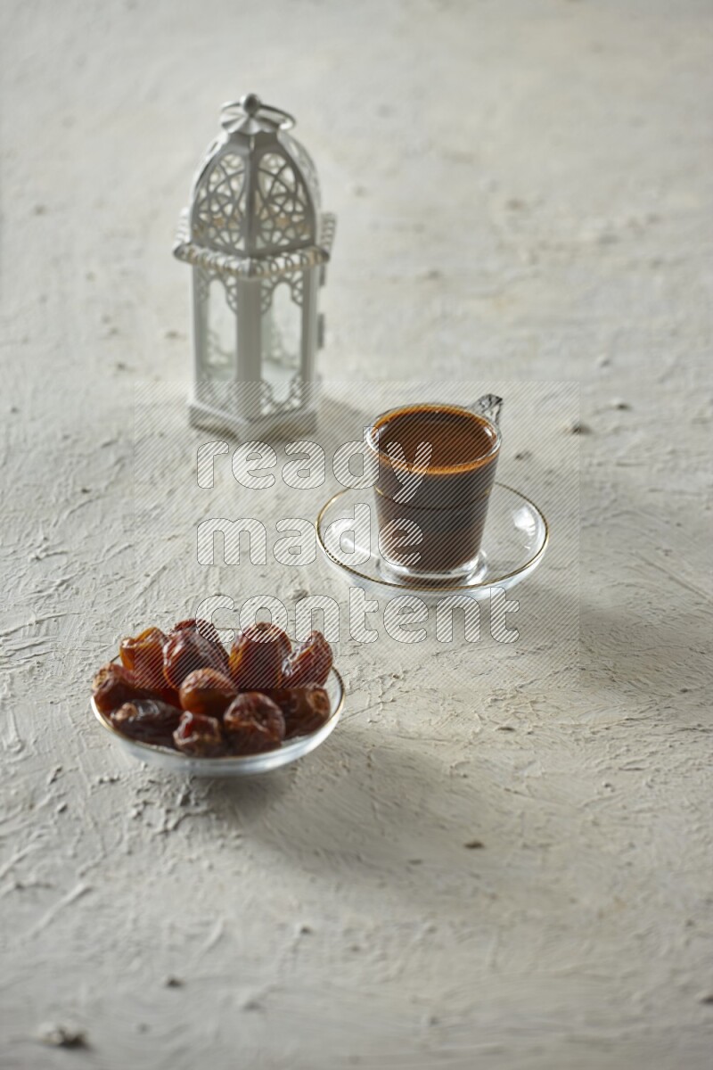 A white lantern with different drinks, dates, nuts, prayer beads and quran on white background