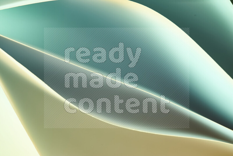 This image showcases an abstract paper art composition with paper curves in green and yellow gradients created by colored light