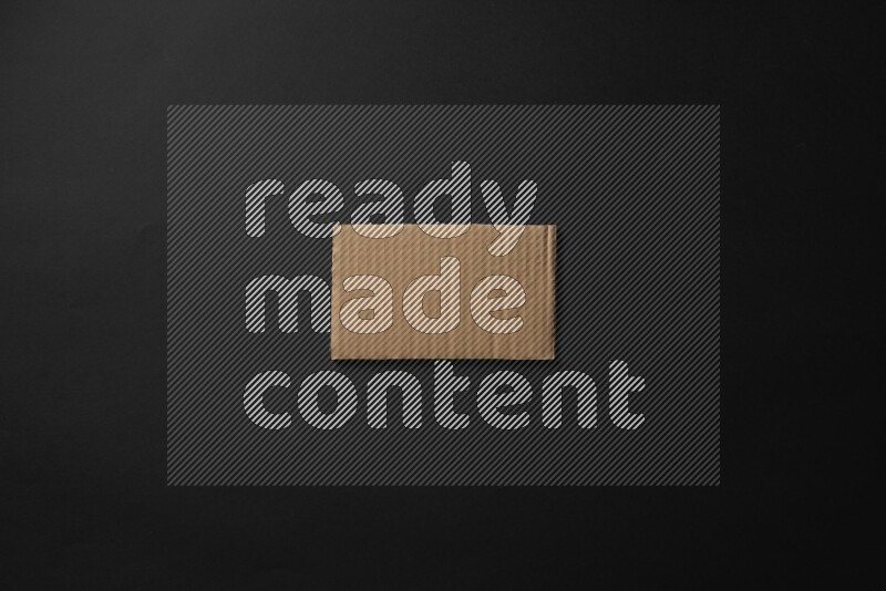 Cardboard in shapes on black background