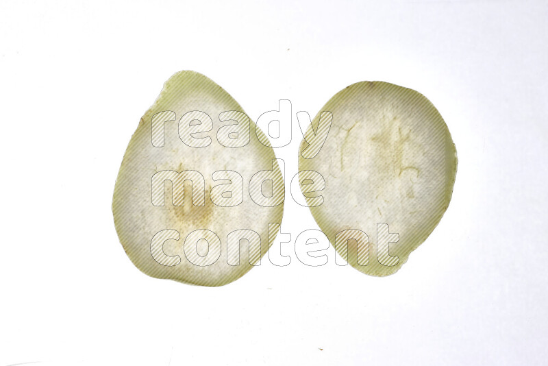 Pear slices on illuminated white background
