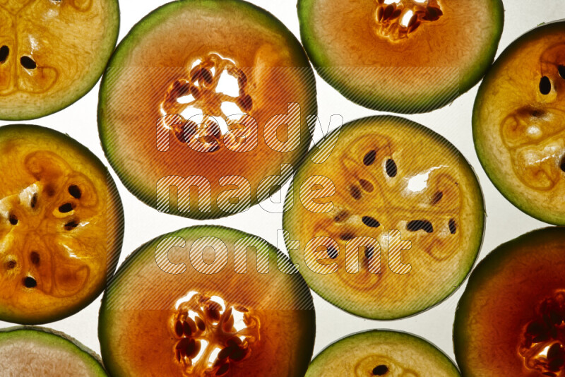 Watermelon slices on illuminated white background