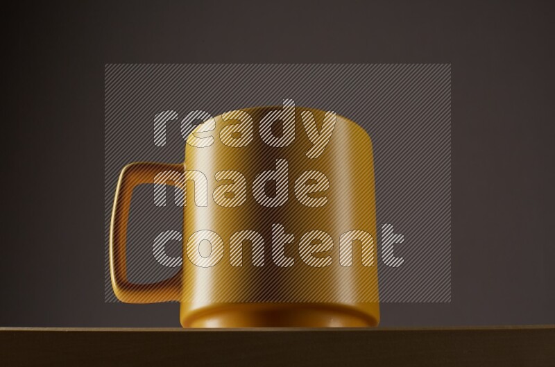 Low angle shot of a yellow cup on grey background