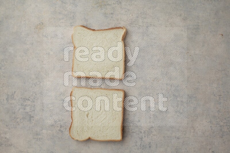 White Toast slices on alight blue textured background