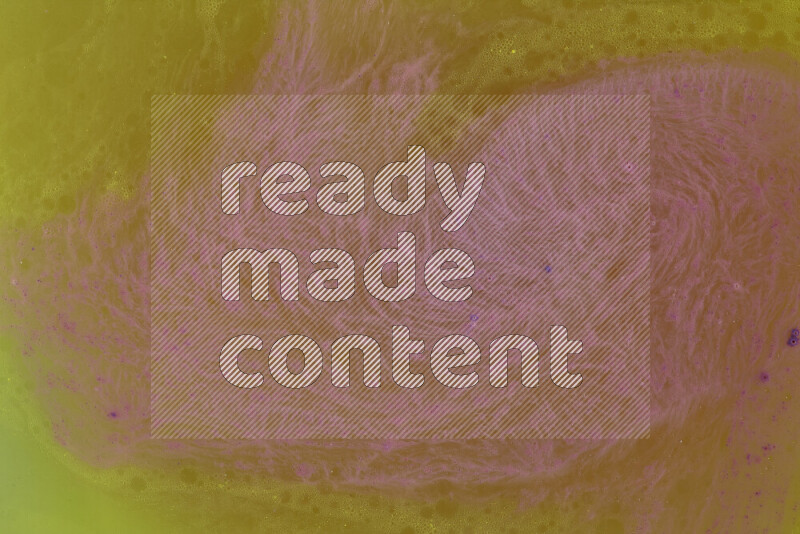 The image captures a dramatic splatter of purple paint over a yellow backdrop