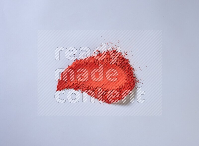 Red powder smears on white background