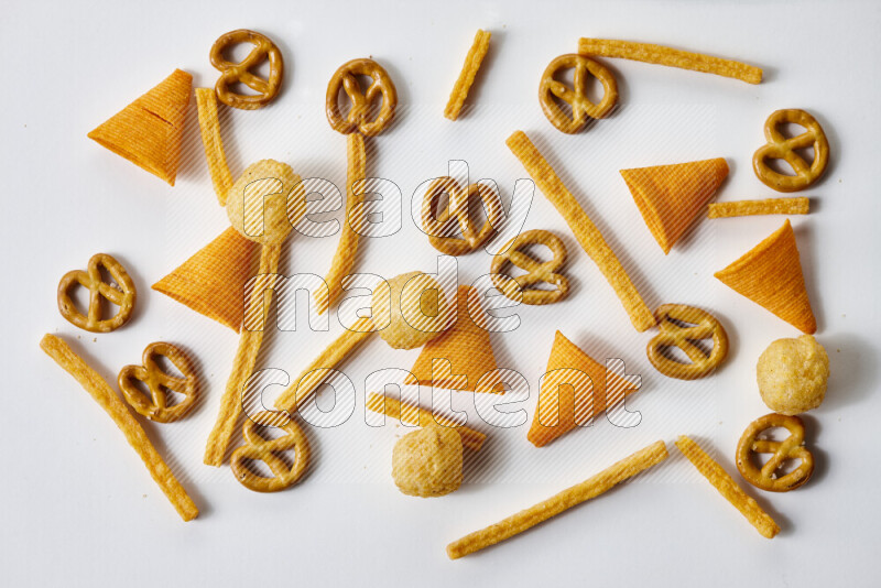 Assorted snacks on white background