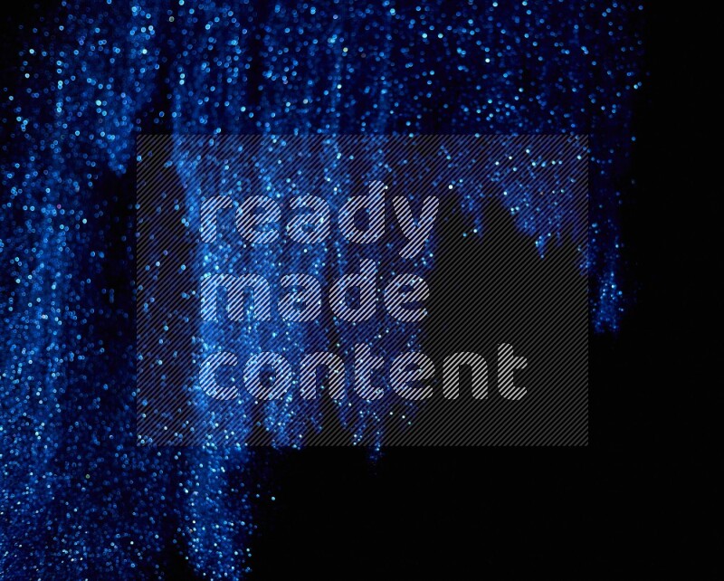 Blue glitter powder isolated on black background