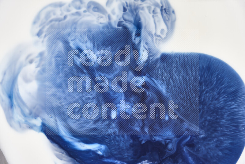 A close-up of abstract swirling patterns in blue and white