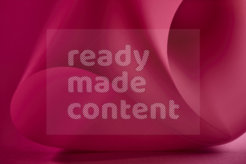 فن تجريدي يعرض منحنيات وتدرجات اللون الأحمر مكونه بضوء ملون