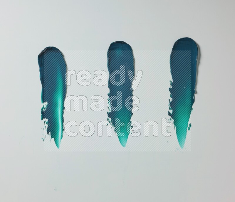 Turquoise painting knife strokes on white background