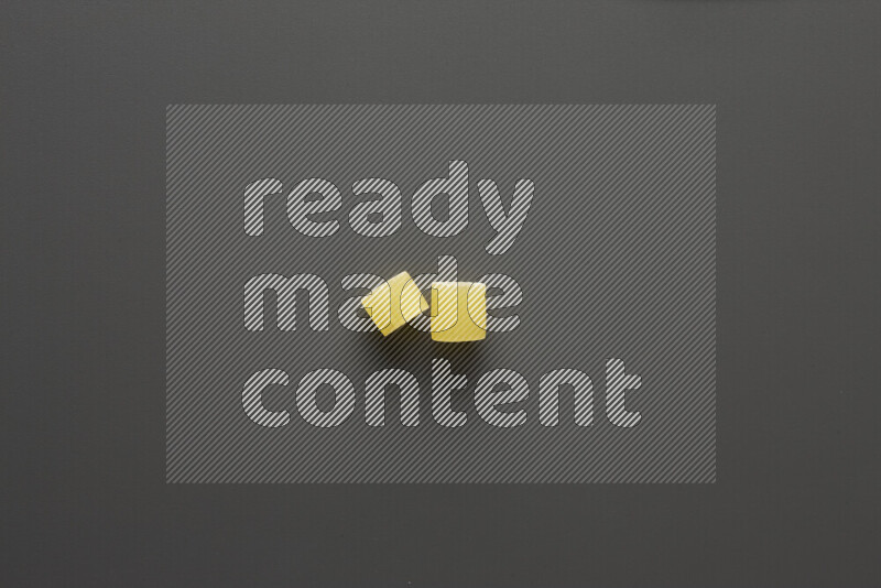 Big rings pasta on grey background