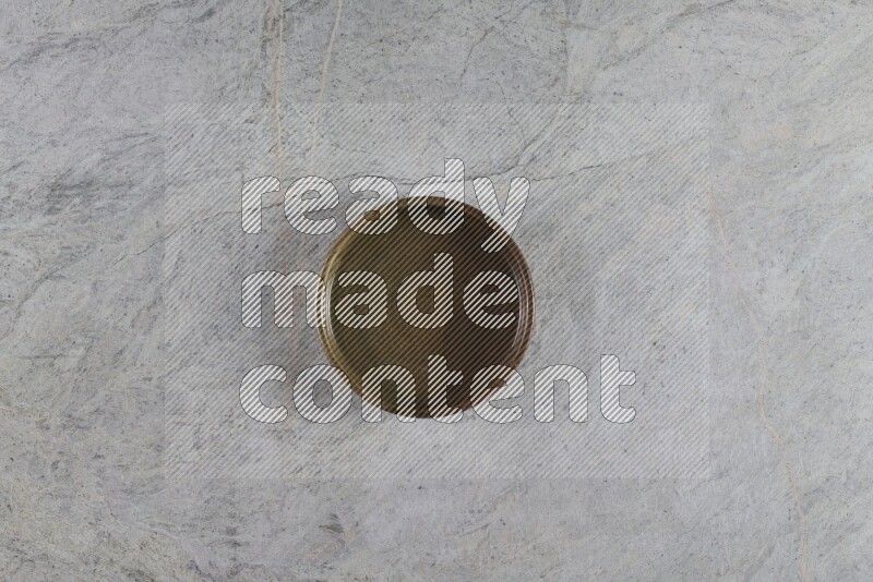 A multicolored pottery oven bowl on grey marble background