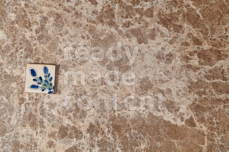 A decorative coaster on beige marble background