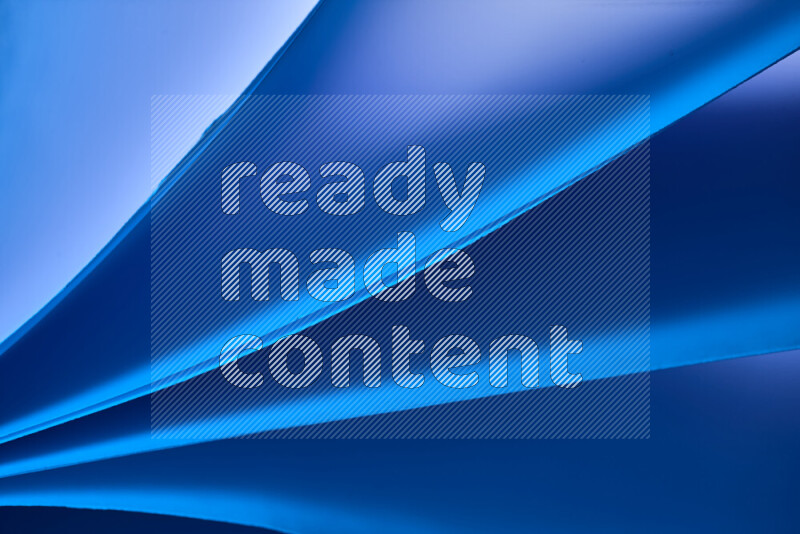 An abstract art piece displaying smooth curves in cold gradients created by colored light