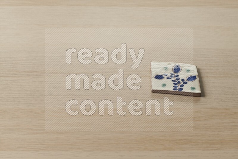 قواعد أكواب مزخرفة على خلفية خشبية فاتحة