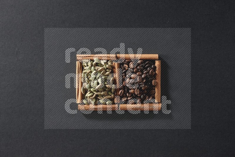 2 squares of cinnamon sticks full of coffee beans and cardamom on black flooring