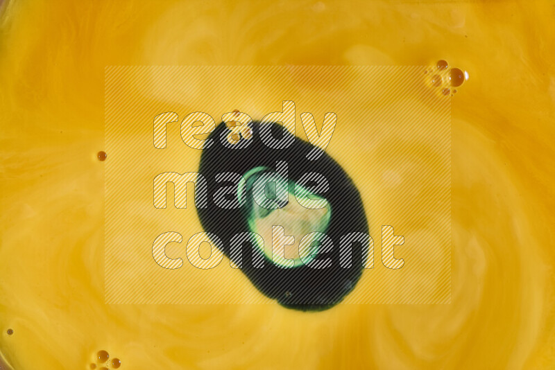 A close-up of abstract swirling patterns in orange and green