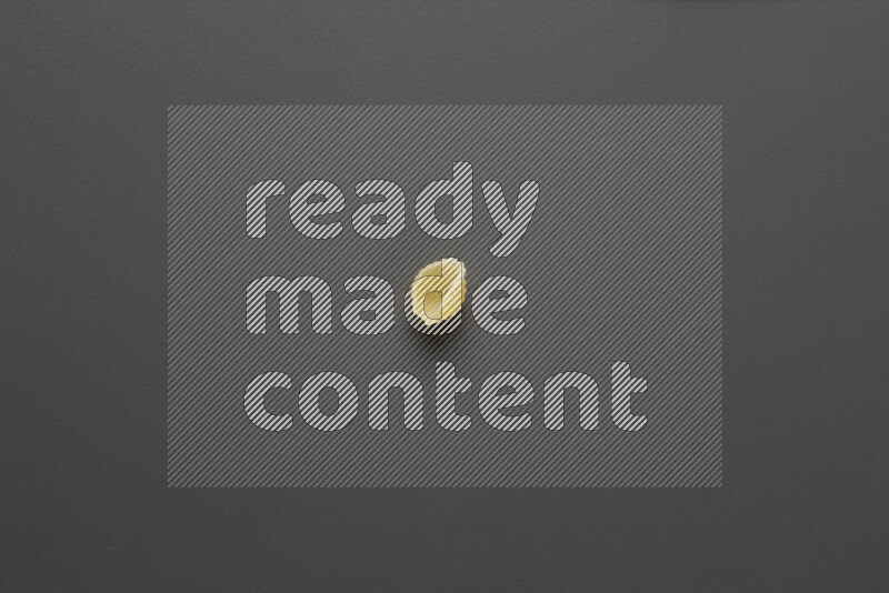 Shells pasta on grey background