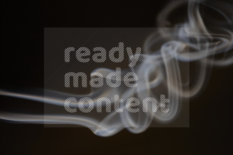 Motion of wavy smoke isolated on dark background