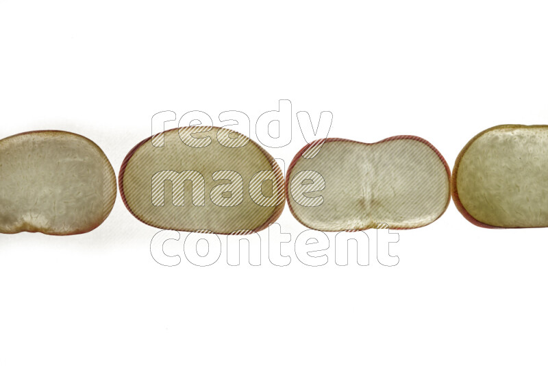 Peach slices on illuminated white background