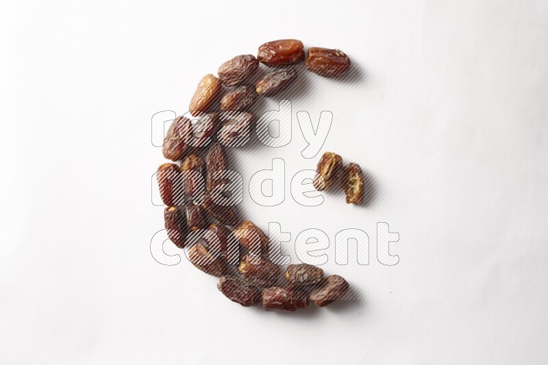 Dates in a crescent shape on white background
