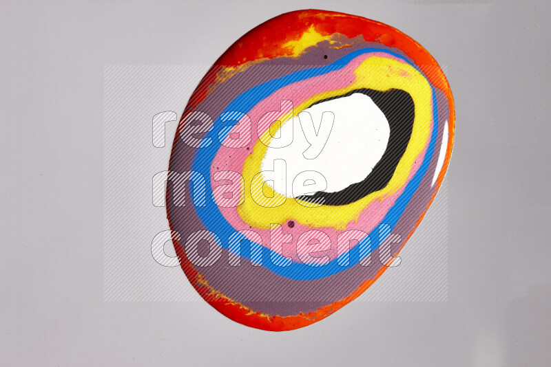 Close-ups of assorted colors blending on a grey background