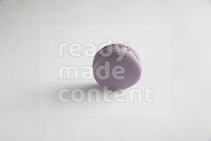 45º Shot of Purple Blueberry macaron on white background