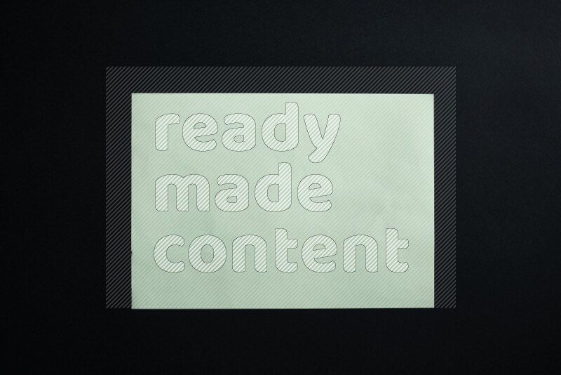 Green paper sheet on black background