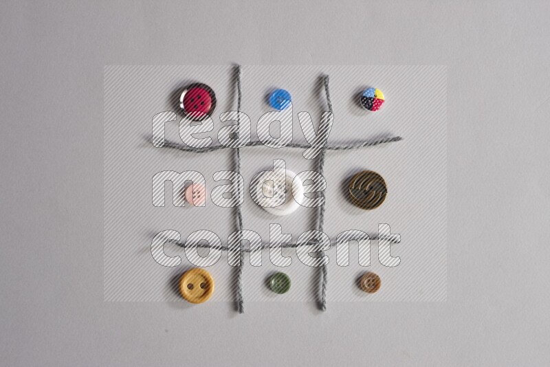 Multicolored buttons placed on grey background