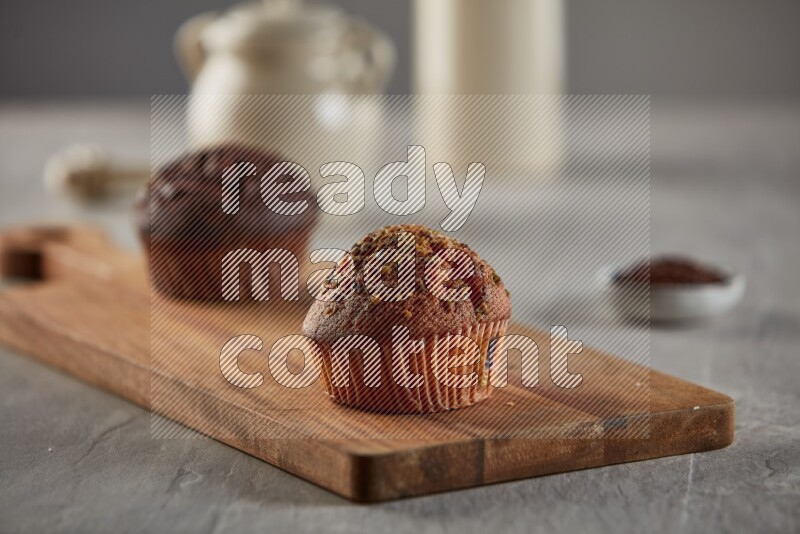 Pistachio cupcake on a wooden board
