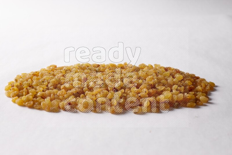 Raisins on white background