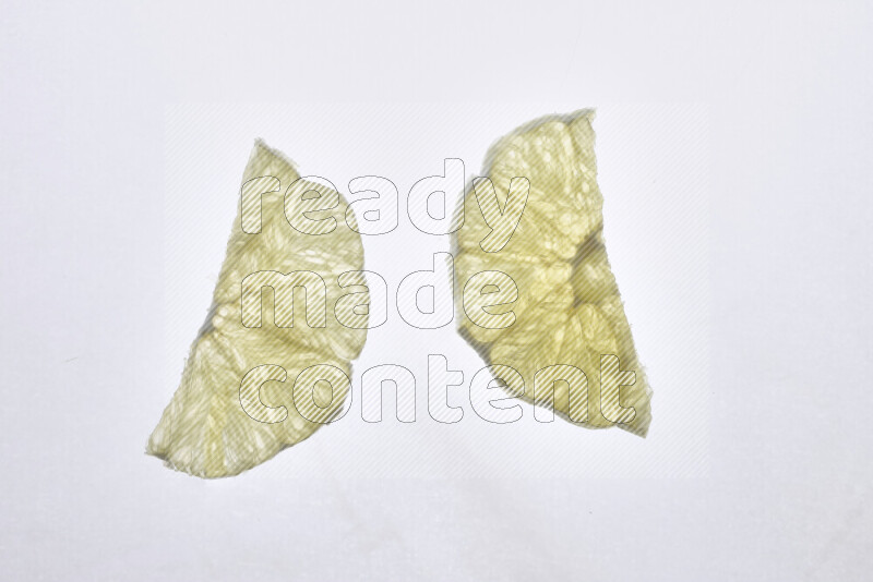 Orange slices on illuminated white background